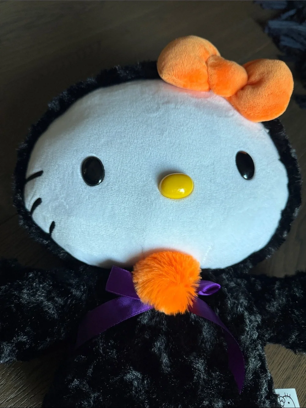 Sanrio Hello Kitty Black & Orange Plush Costume with Purple Bow